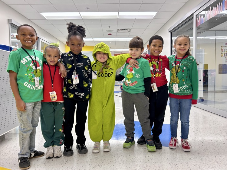 students smiling in holiday clothing!