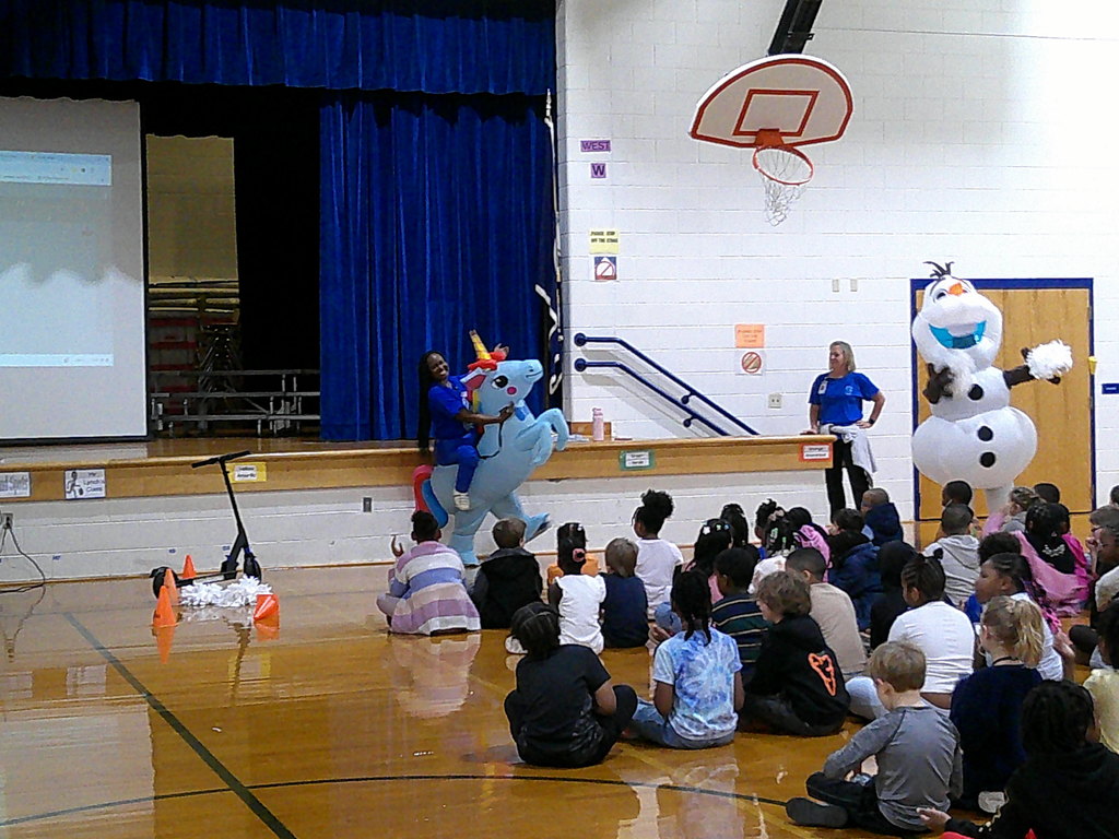 Mrs. Foard and Mrs. Gurkin playing professional air guitar