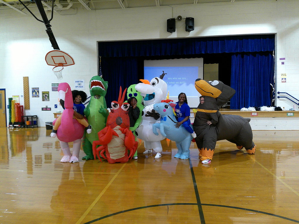Mrs. Battle, Mrs. Bohne, Ms. Sawyer, Ms. May, Mrs. Gurkin, Mrs. Foard, and Mrs. Chrisman in character inflatable costumes