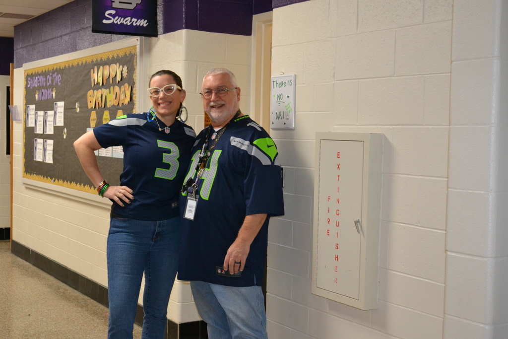 Mr. McKee and Mrs. Hamilton wearing their Seahawks jerseys for Twin day.