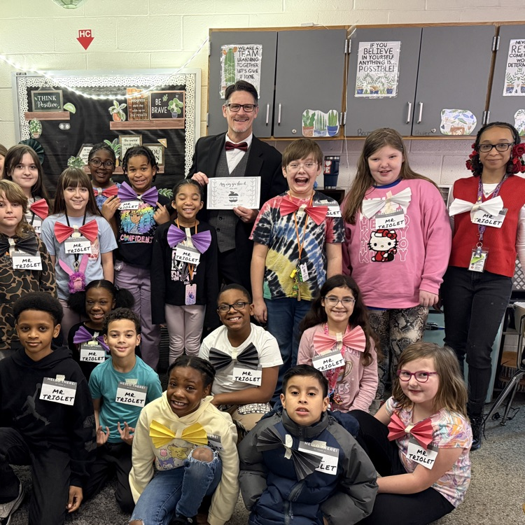 Mr. Triolet with students wearing bow ties