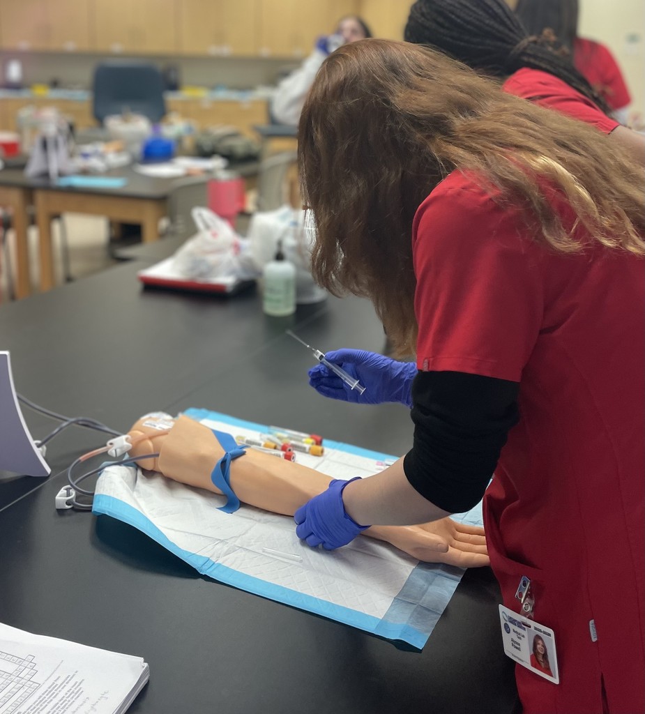 Med Lab students practicing blood draw