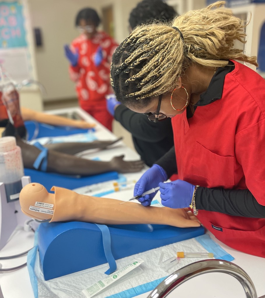 Med Lab students practicing blood draw