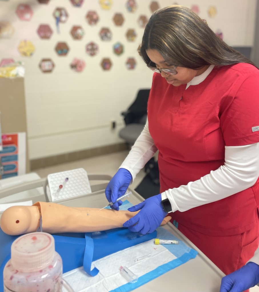 Med Lab students practicing blood draw