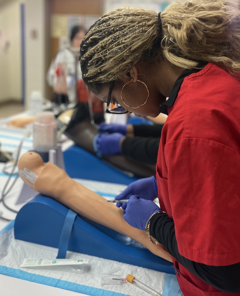 Med Lab students practicing blood draw