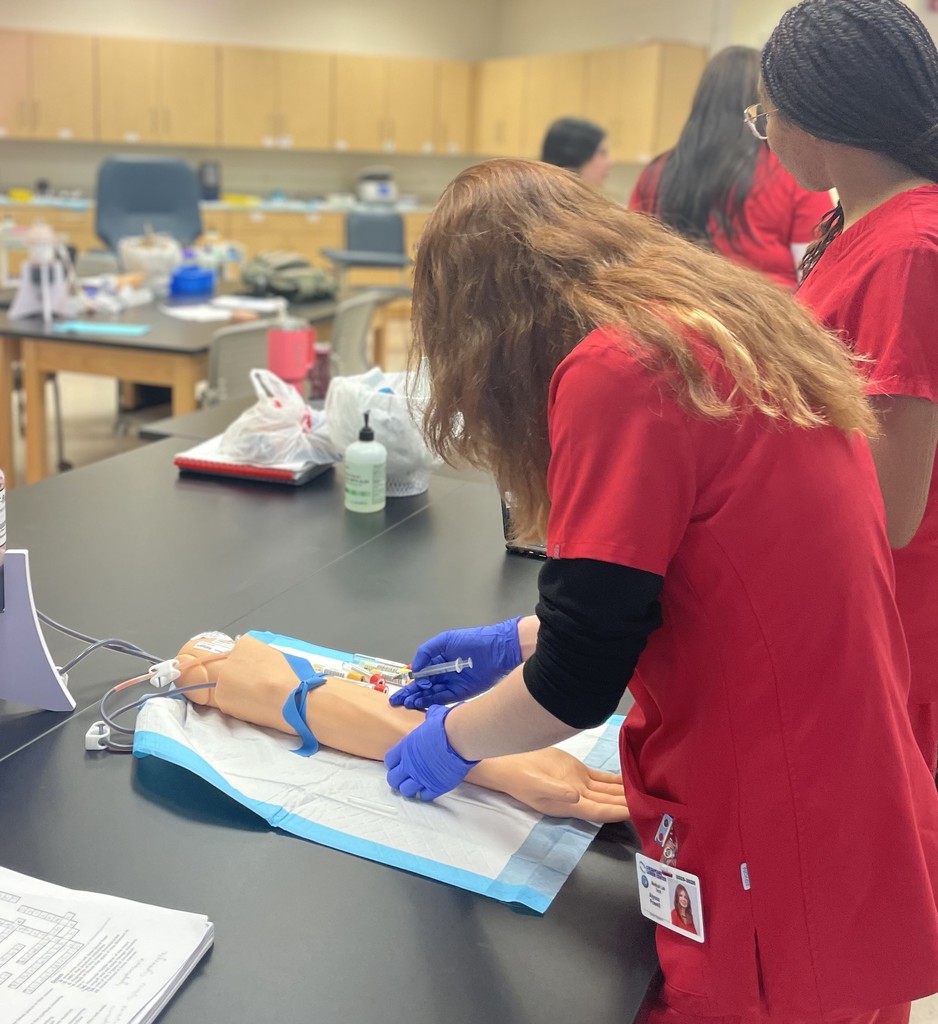 Med Lab students practicing blood draw