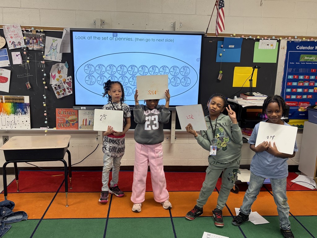 Ms. Lloyd's class are learning about coins and the value of a quarter.