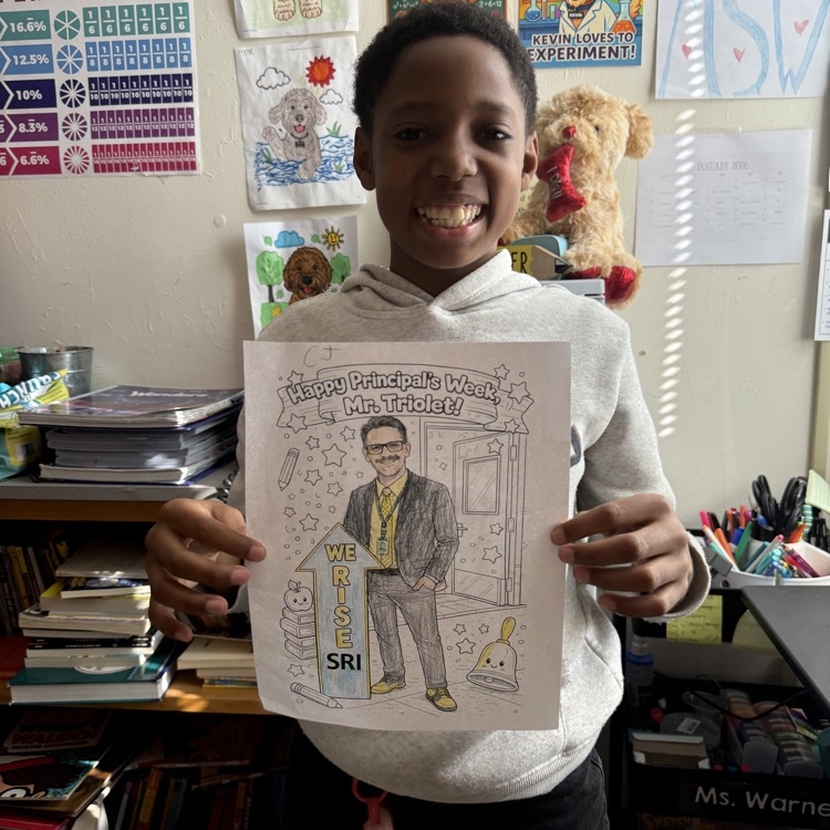 student holding coloring page with Mr. Triolet