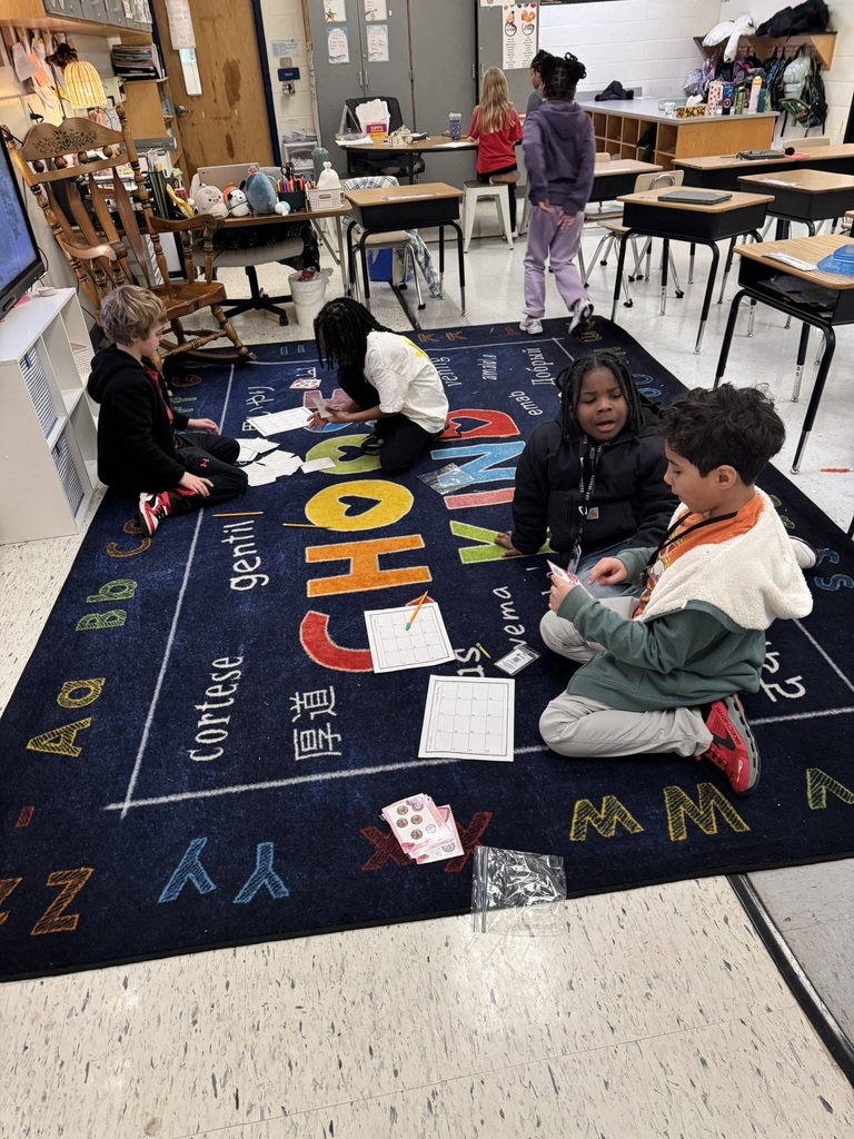 students work together on money activity