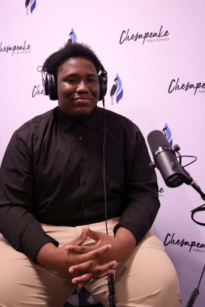 Adrian Langaster, student, smiling in the podcast studio.