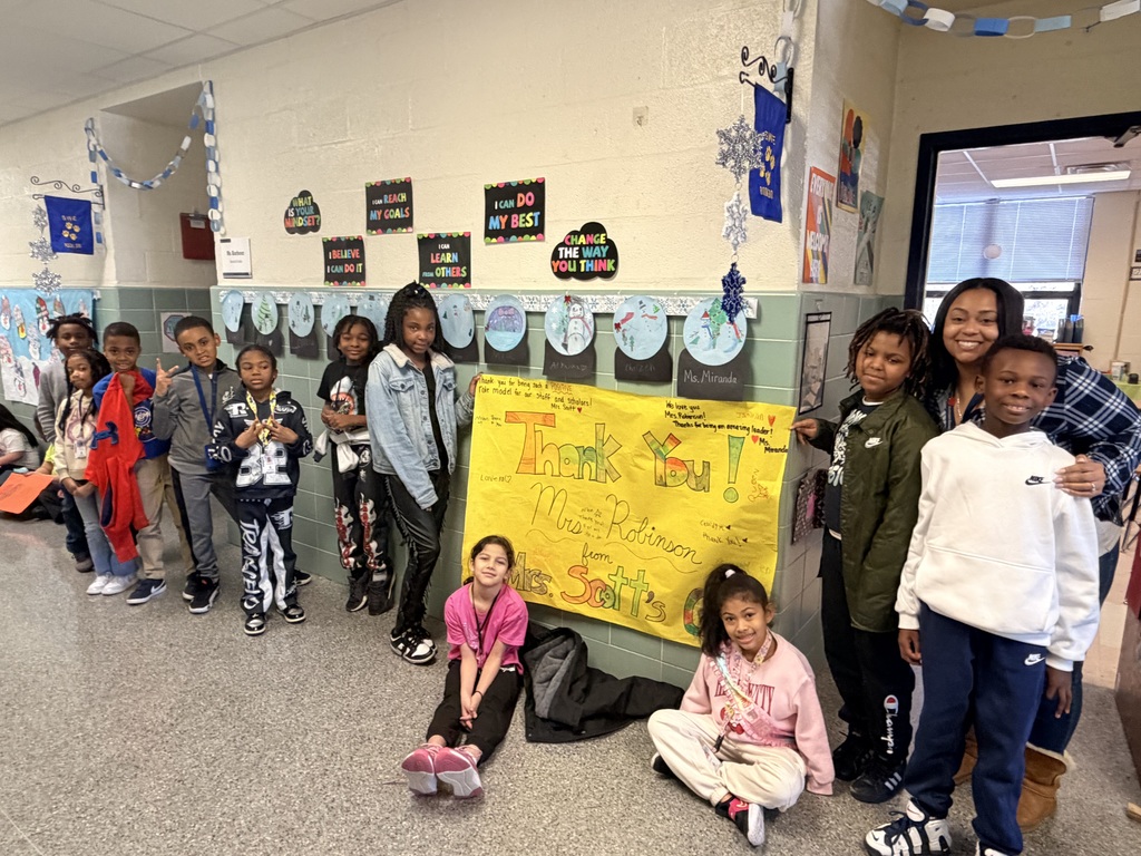 students with signs to celebrate the principal Mrs. robinson