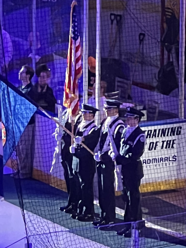 Pic of ROTC students presenting colors at hockey game