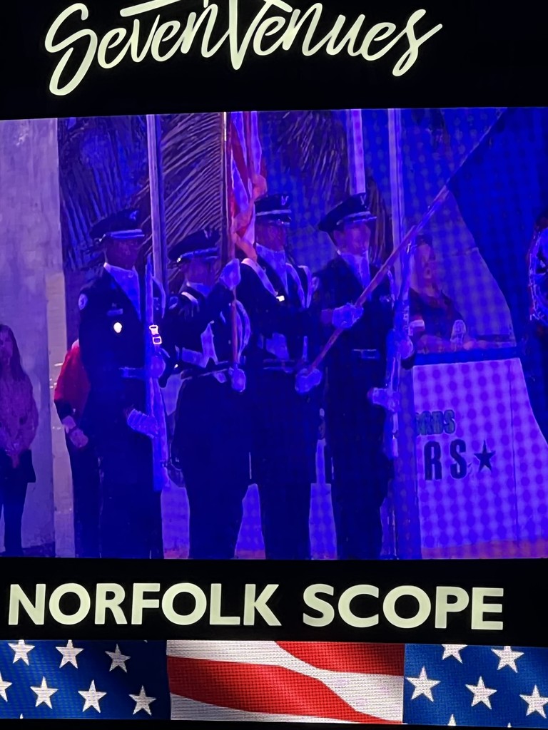 Pic of ROTC students presenting colors at hockey game