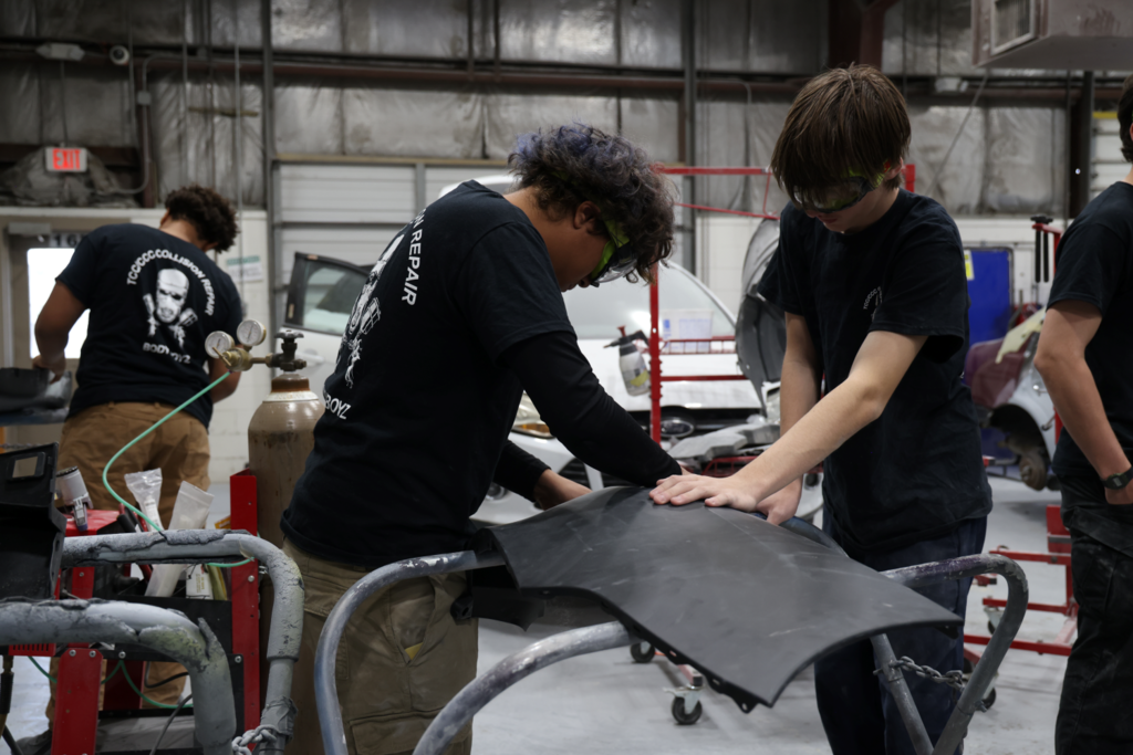 CCC Auto Tech students working on metal piece