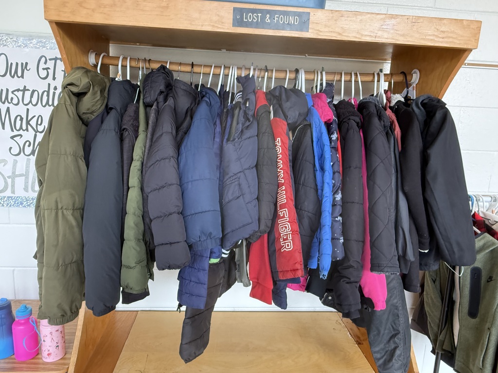 several coats and jackets in the lost and found