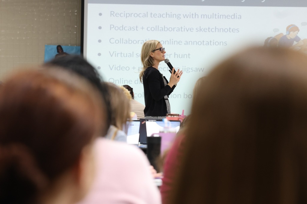 Dr catlin Tudker in distance speaking