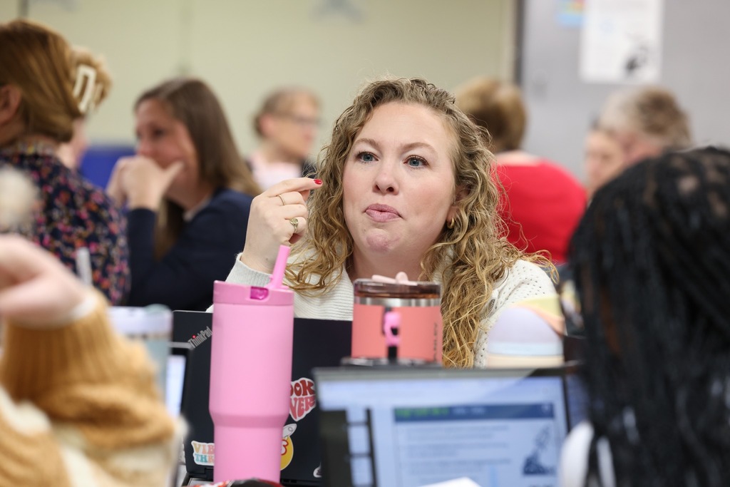 female teacher learning in group
