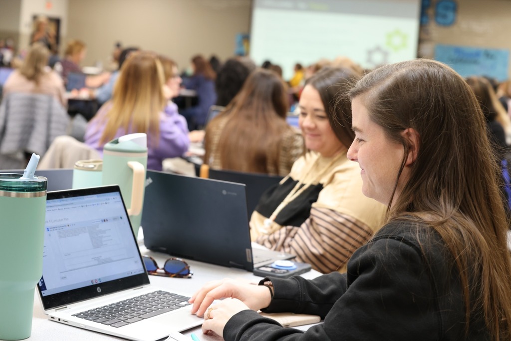 female teachers on laptop learning