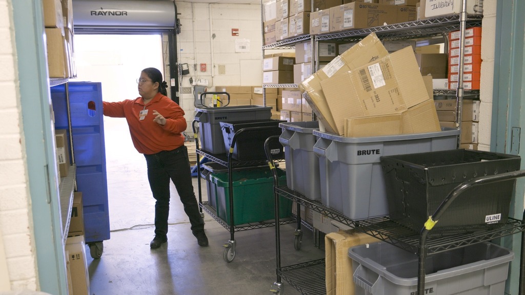 young woman unloading recyclables
