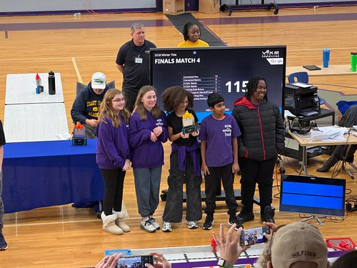 Five students with their robotics awards