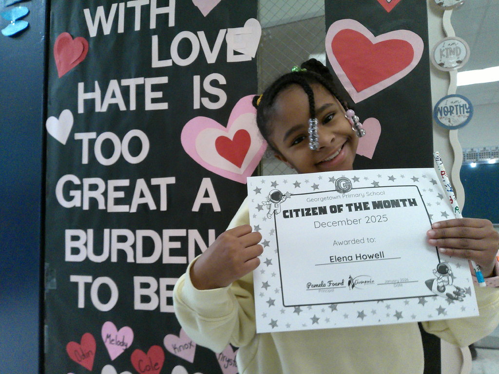 Elena Howell  holding her Citizen of the Month certificate