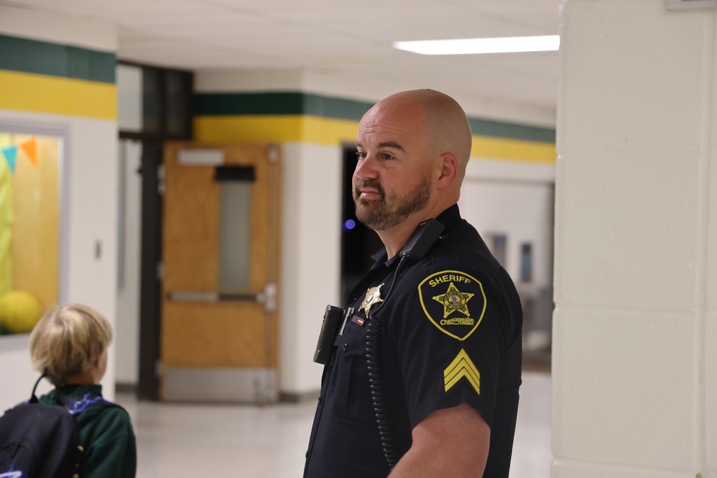 male SRD in uniform watching students