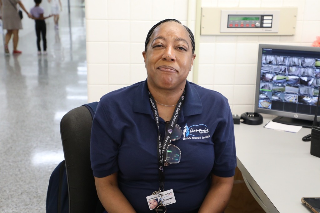 female security officer smiling