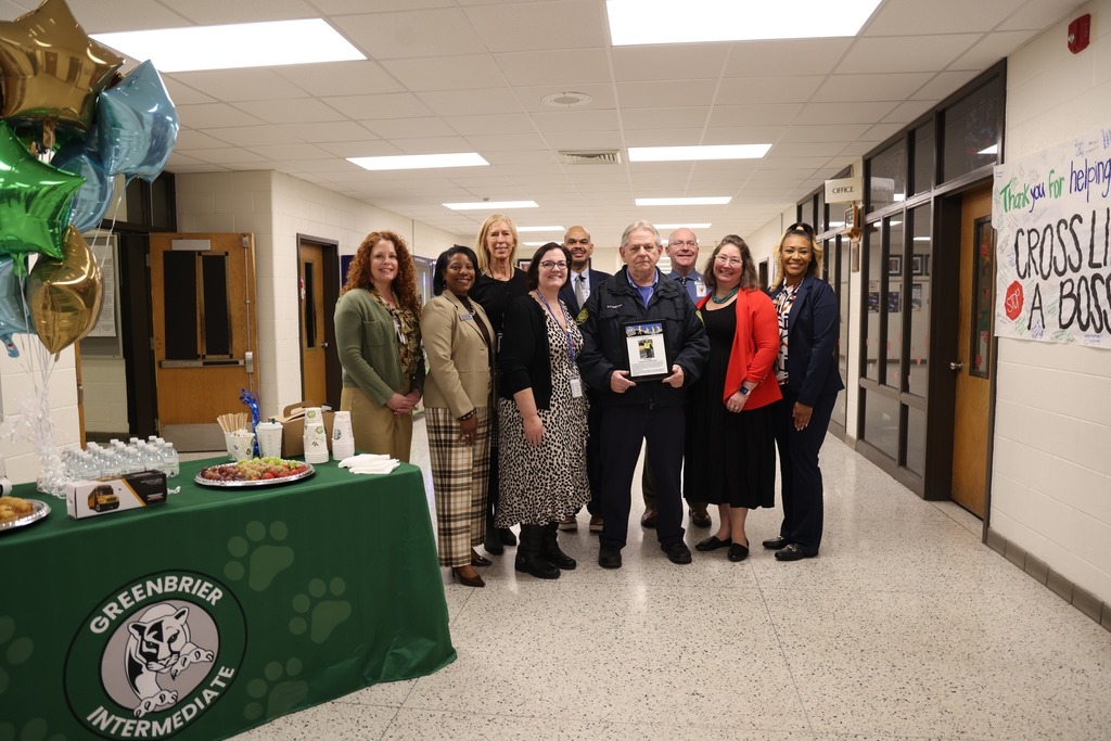 Full length shot of Mr. Compton with CPS Administrators in hallway