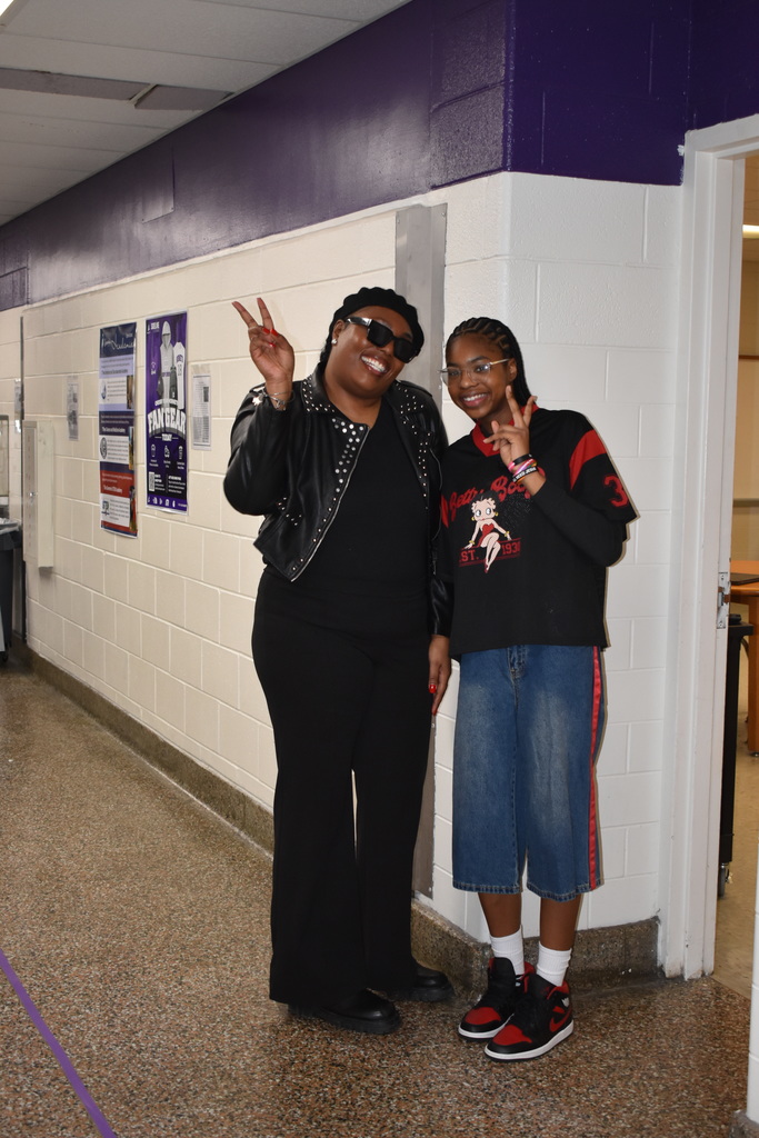 A teachers and a student dress up as the 90s