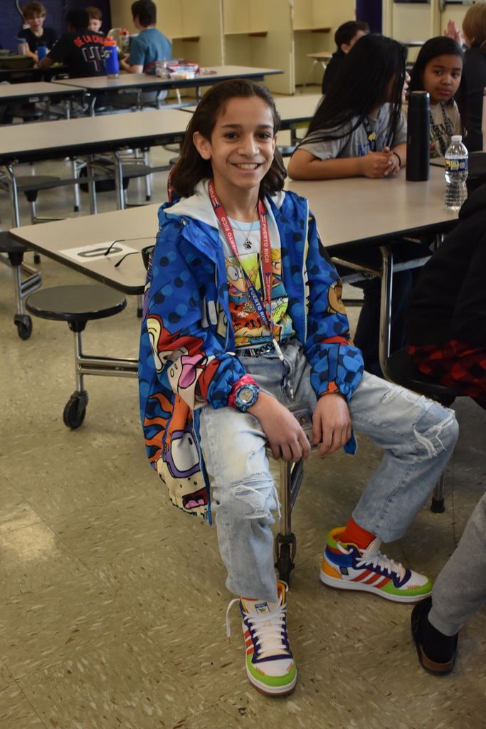 A student wearing a his 90s cartoon gear