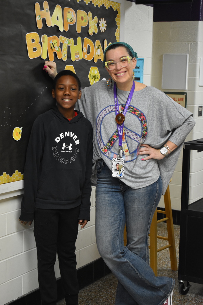 A teachers and a student> the teacher is in her 70s outfit.