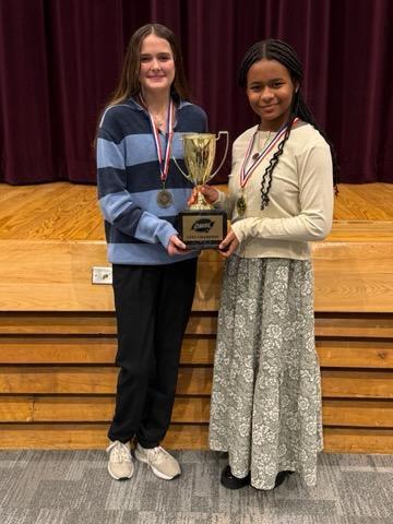 Speech students with trophy
