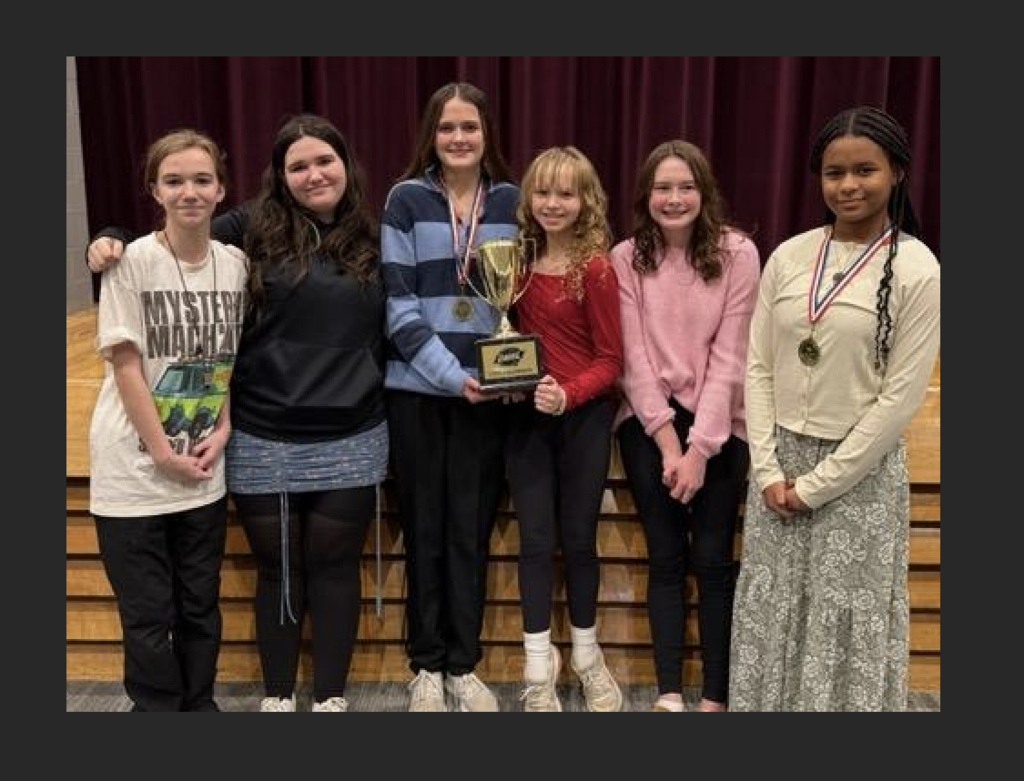 Speech students with trophy