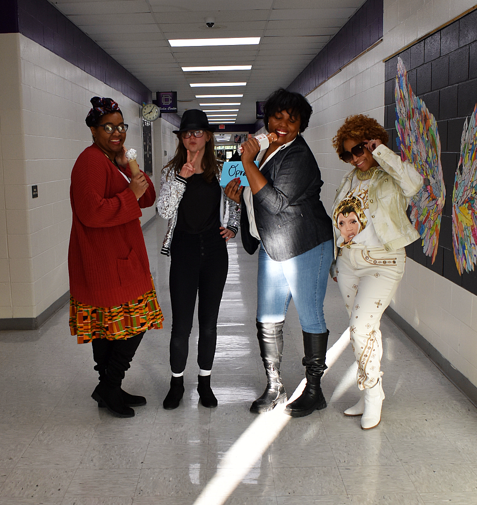 Three teachers and a student showing up as singers and actors.