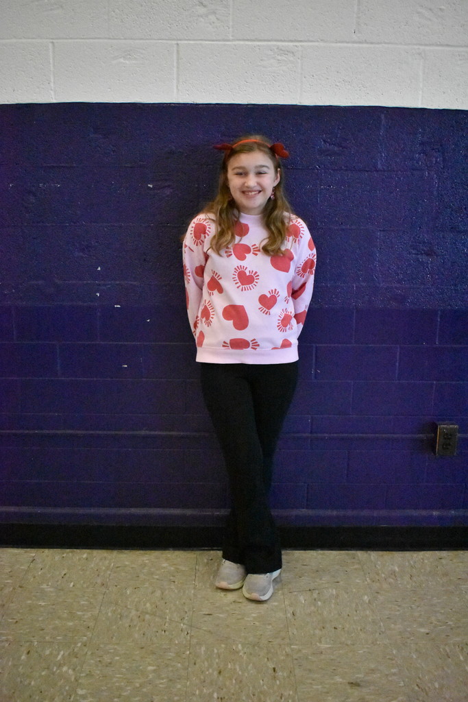 A student wearing her Valentine's day heart sweater.