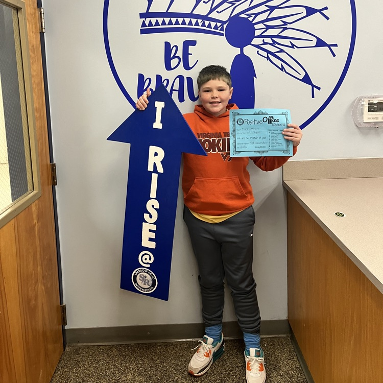 Student with Positive Behavior Referral Certificate and I RISE arrow