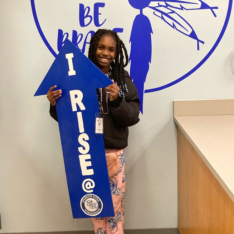 student with I RISE arrow