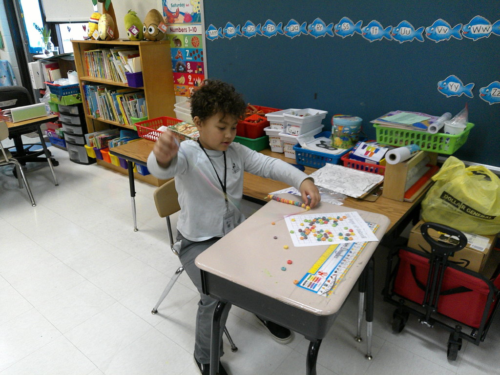 student builds his 100th day necklace