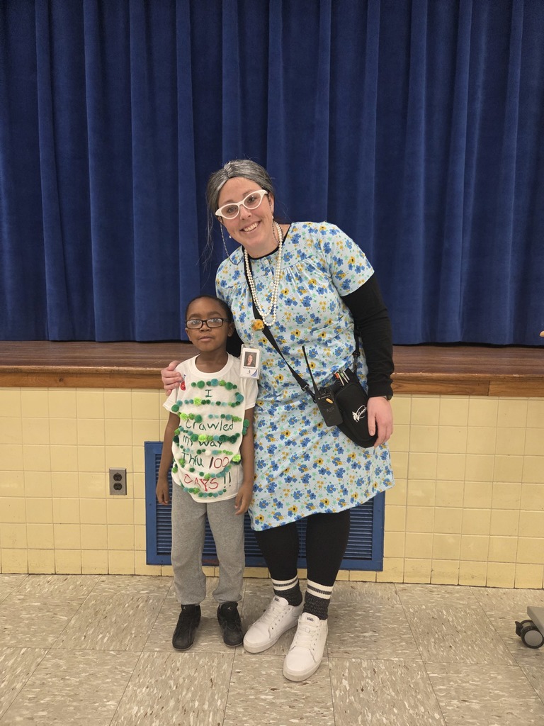 Mrs. Szymborski and A. Saunders dressed for the 100th day