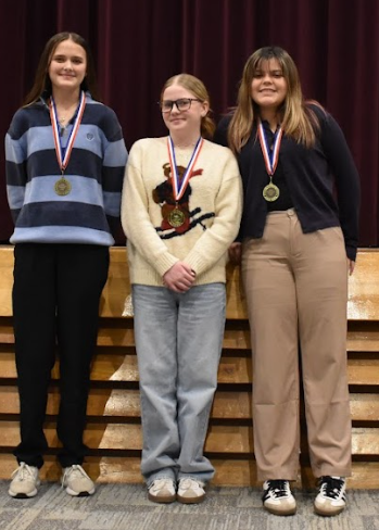 3 girls with medals in prose