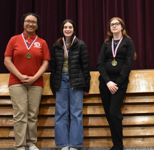 2 girls with medals in Poetry