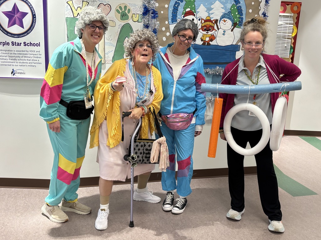 Mrs. Teeman, Mrs. P Jones, Mrs. Scott, and Coach Rafter dressed as 100 yr olds on the 100th day of school