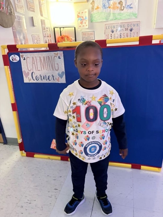 student wearing a homemade 100th day of school shirt