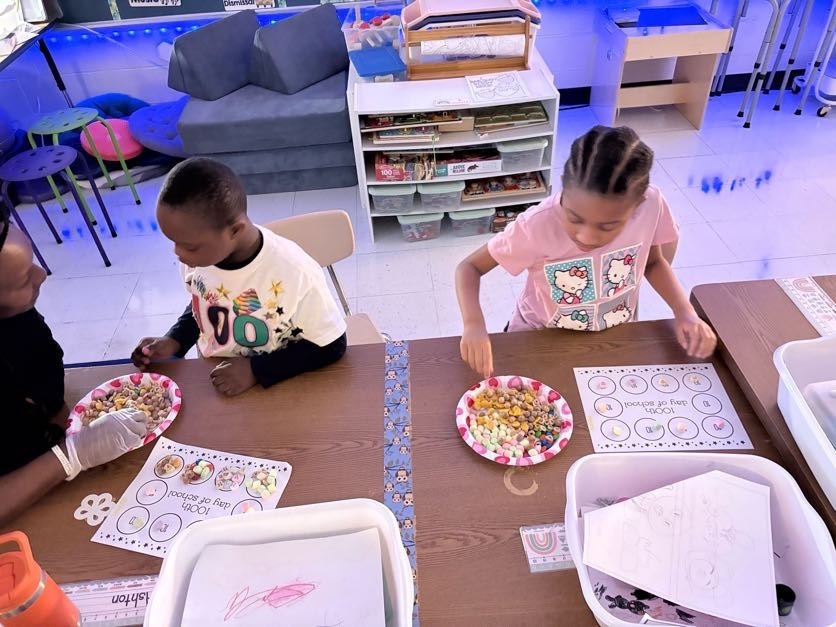 students participating in an edible 100 counting activity