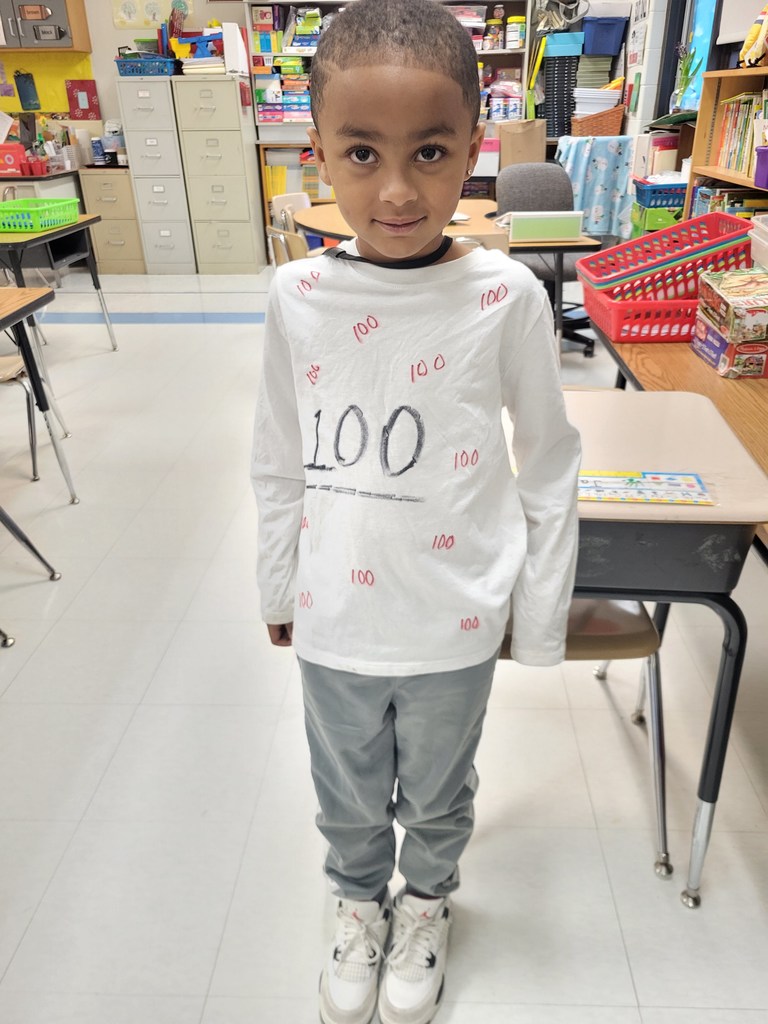 student in his homemade 100th day shirt