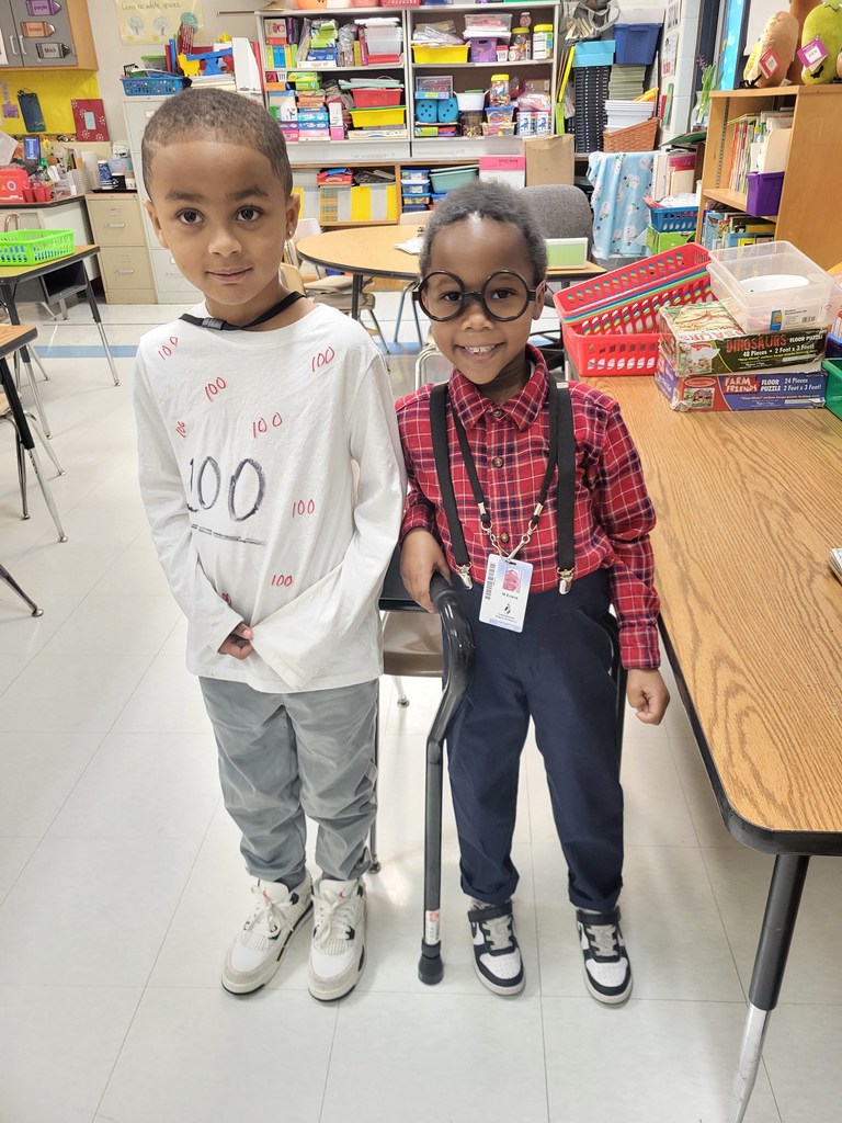 students celebrate the 100th day of school with a homemade shirt and dressed as an old man