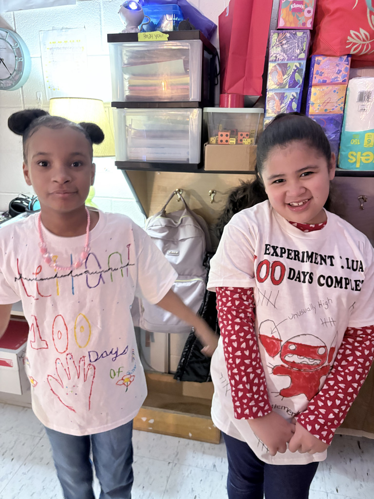 students wearing homemade 100th day of school shirts