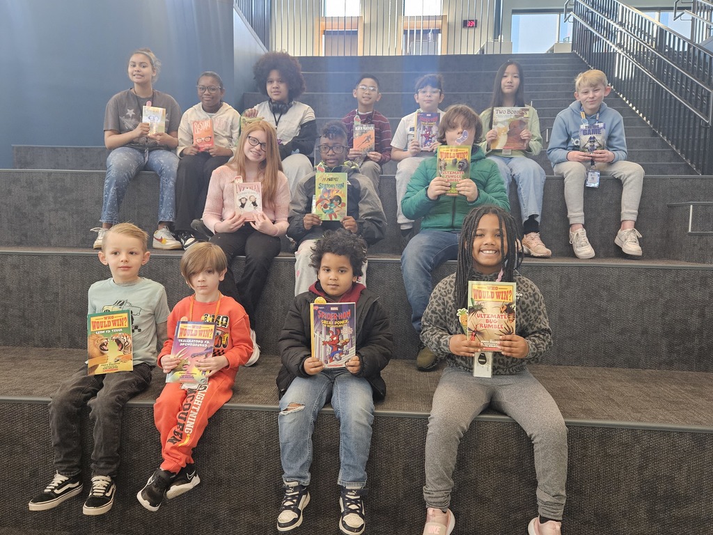 Students sitting on learning stairs