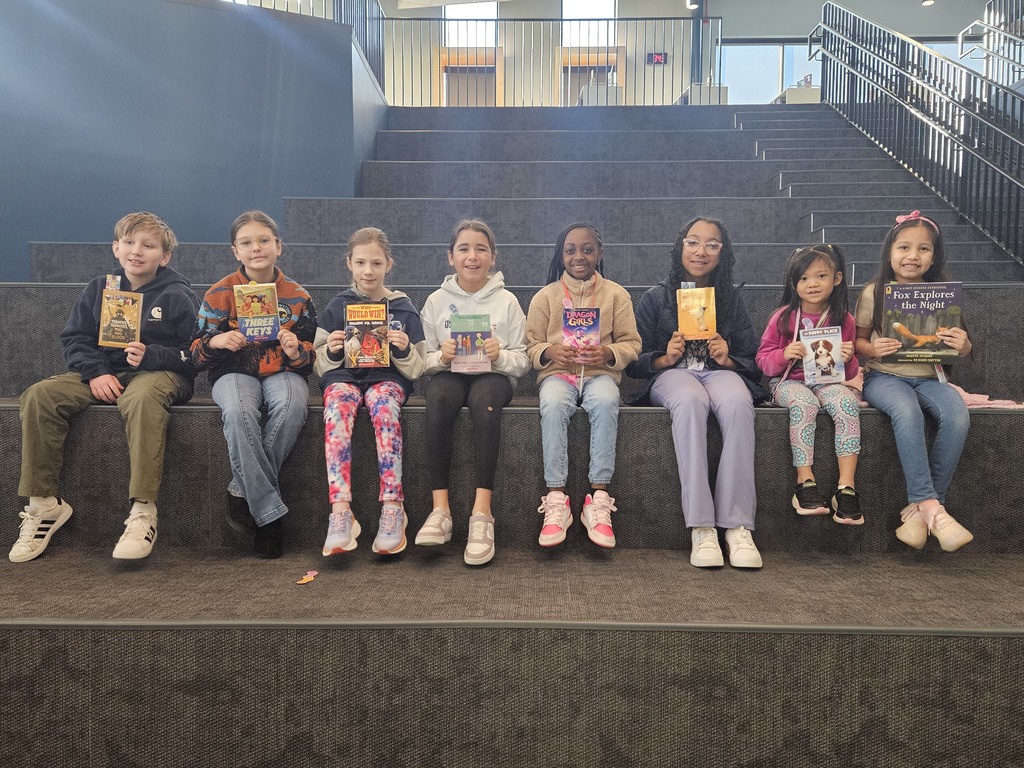 Students sitting on learning stairs