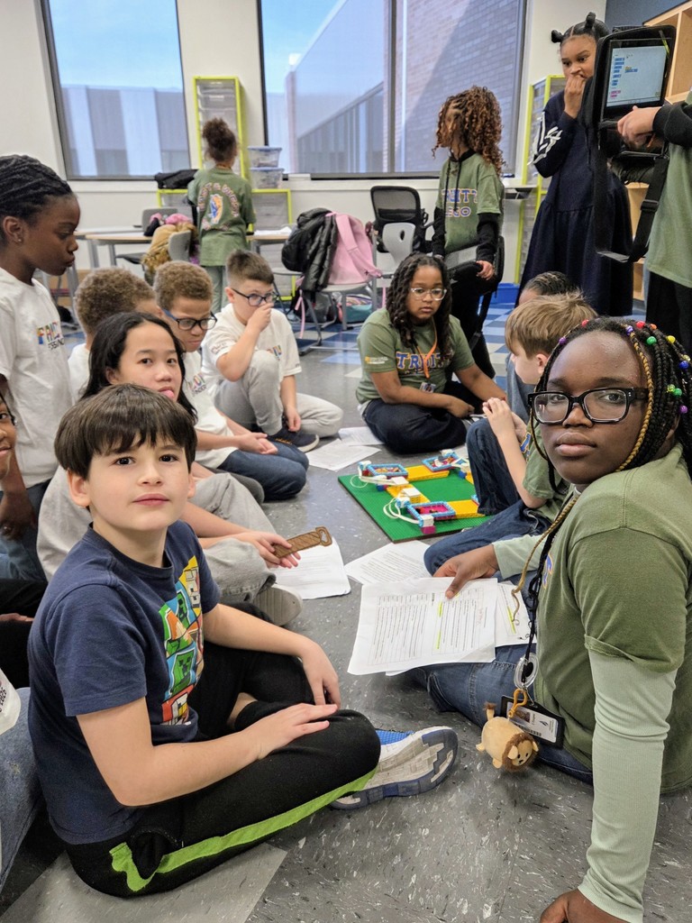 Lego Team members sitting on the floor